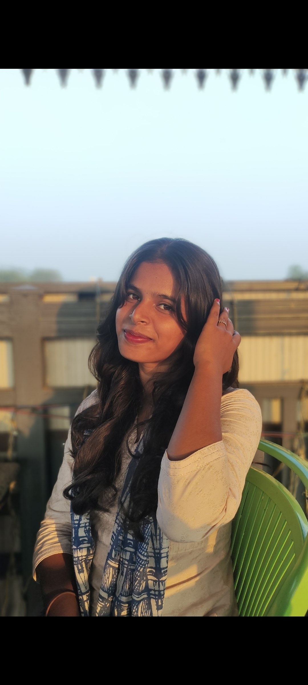A close-up portrait on a rooftop